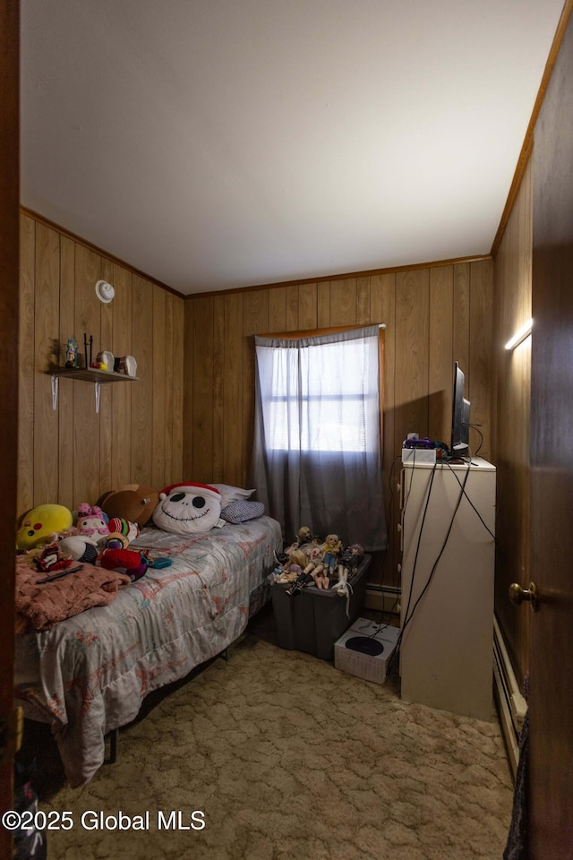 carpeted bedroom with a baseboard heating unit and wooden walls