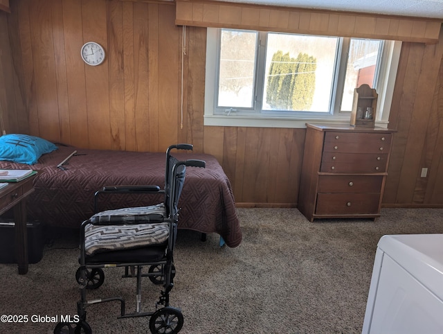 bedroom with carpet floors and wooden walls