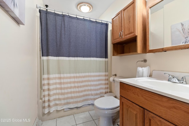 full bathroom with vanity, toilet, tile patterned flooring, and shower / bath combo