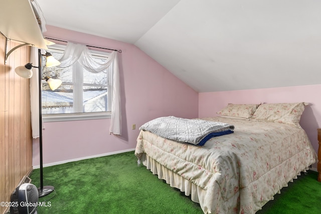 bedroom with lofted ceiling and dark carpet