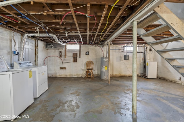 basement with water heater and independent washer and dryer