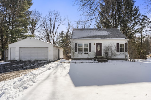 view of front of home featuring a garage and an outdoor structure