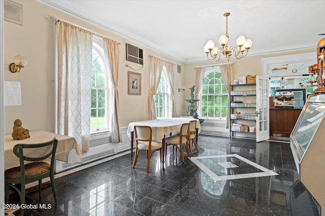 dining space with crown molding and a chandelier