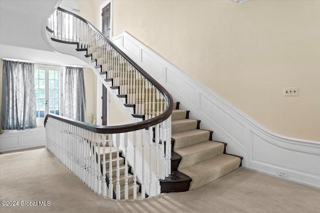 staircase with a high ceiling