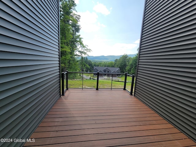 wooden terrace with a mountain view