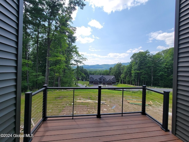 wooden terrace featuring a mountain view