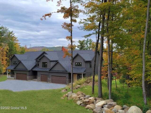 view of front of house with a mountain view and a garage