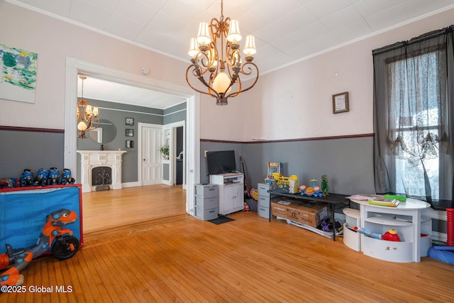 interior space with light wood-type flooring and a notable chandelier