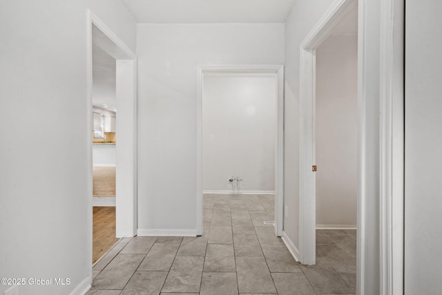 hallway featuring light tile patterned flooring