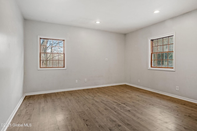 spare room featuring hardwood / wood-style floors