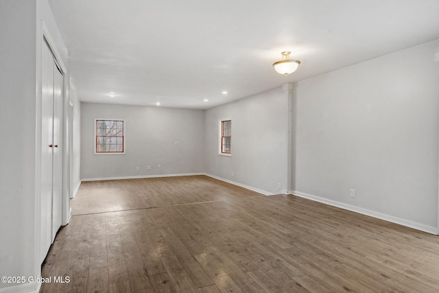 unfurnished room featuring hardwood / wood-style floors