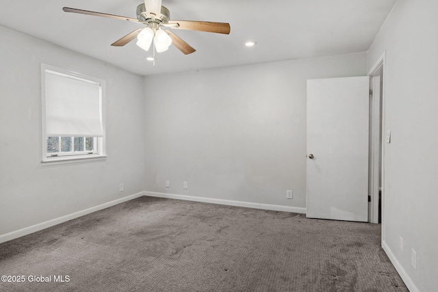 spare room with carpet flooring and ceiling fan