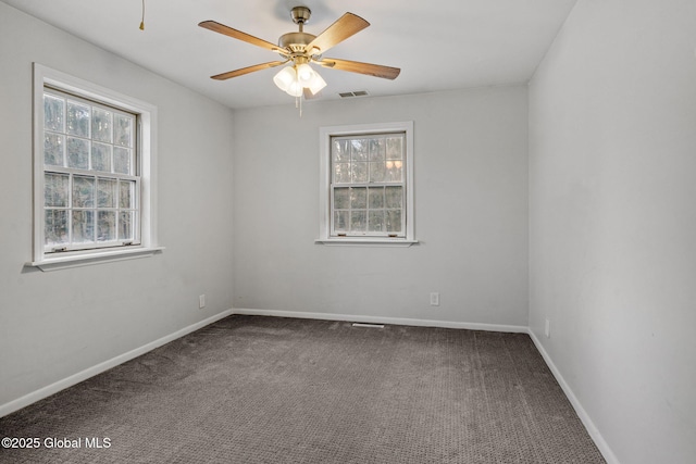 unfurnished room featuring carpet floors, a healthy amount of sunlight, and ceiling fan