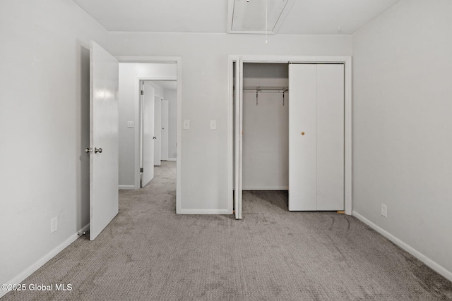 unfurnished bedroom featuring a closet and light carpet