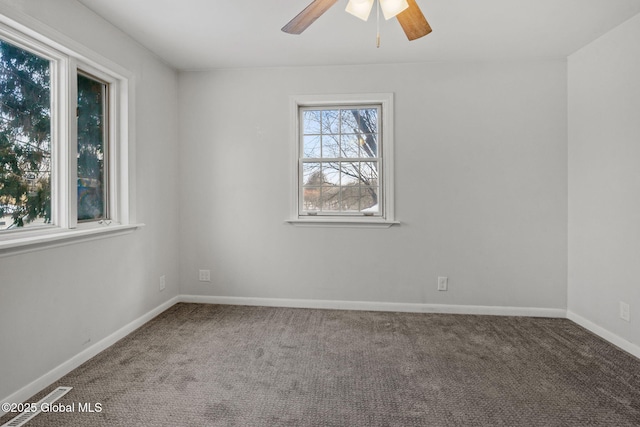 unfurnished room with ceiling fan and carpet flooring