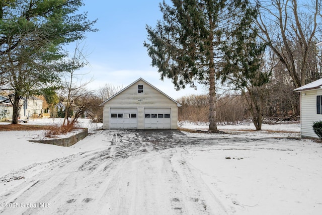 exterior space with an outbuilding and a garage