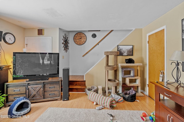 living room with light hardwood / wood-style flooring