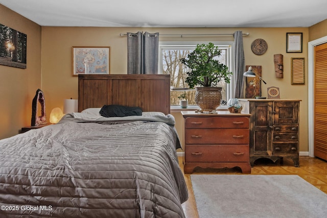 bedroom featuring light parquet flooring