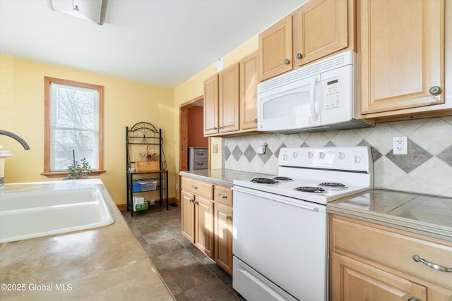 kitchen with white appliances, sink, backsplash, and light brown cabinetry