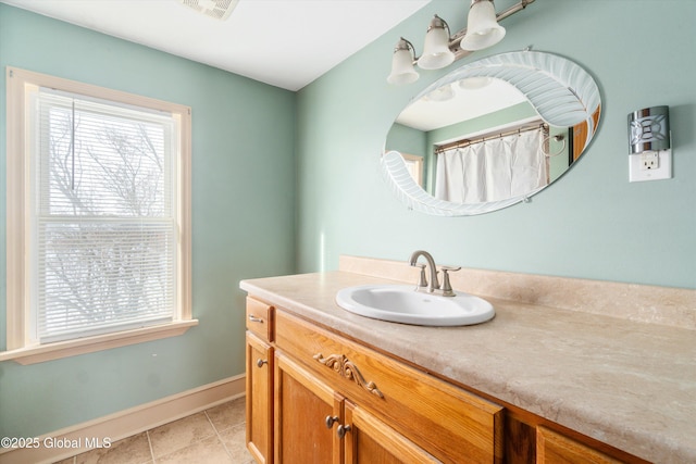 bathroom with tile patterned floors and vanity