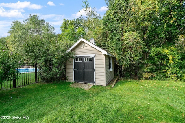 view of outdoor structure with a yard