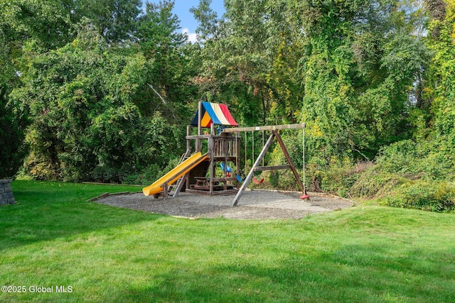 view of jungle gym with a lawn