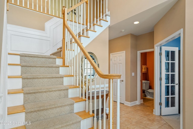 stairway featuring tile patterned floors