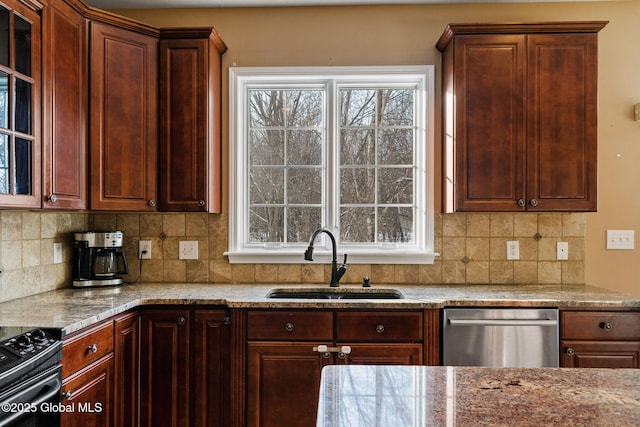 kitchen featuring sink, a wealth of natural light, and stainless steel dishwasher