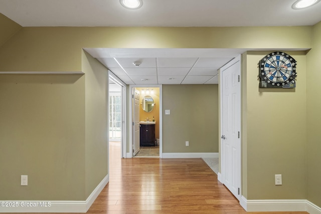 hall with light hardwood / wood-style floors