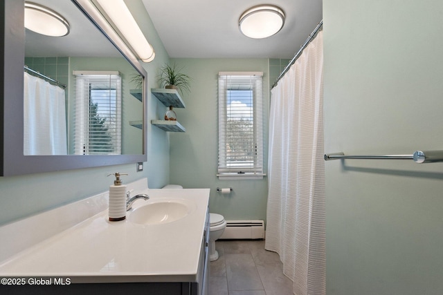 bathroom featuring a baseboard heating unit, a shower with shower curtain, vanity, tile patterned floors, and toilet