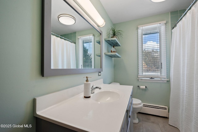 bathroom featuring tile patterned flooring, a baseboard radiator, vanity, and toilet