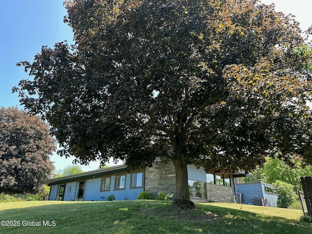 view of home's exterior featuring a lawn