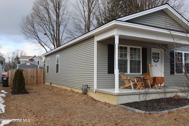 view of side of home with a porch