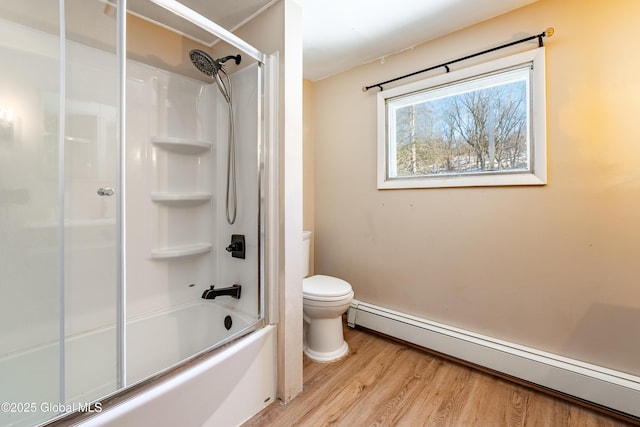 bathroom featuring hardwood / wood-style floors, a baseboard radiator, shower / bath combination with glass door, and toilet