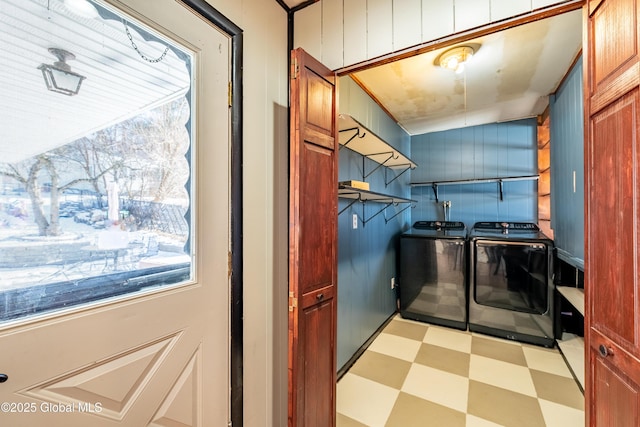 laundry room featuring independent washer and dryer and a healthy amount of sunlight