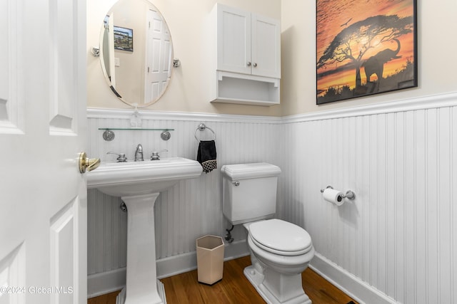 bathroom featuring sink, hardwood / wood-style flooring, and toilet