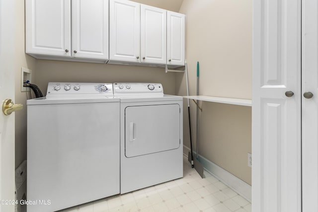 laundry area with cabinets and independent washer and dryer