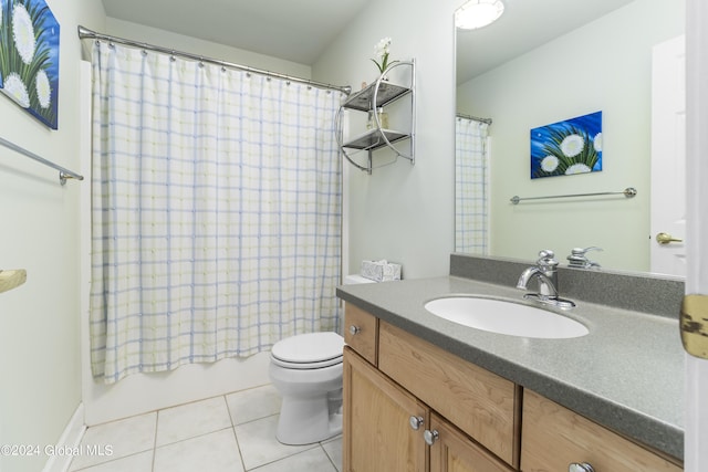 full bathroom featuring tile patterned flooring, shower / tub combo, vanity, and toilet