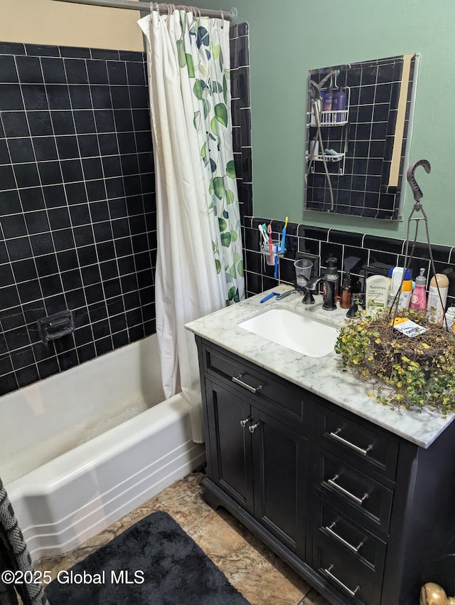 bathroom featuring shower / tub combo with curtain, vanity, and decorative backsplash