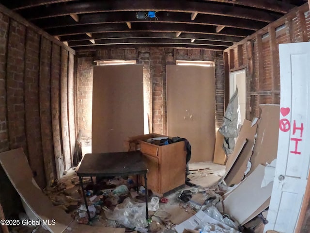misc room with brick wall