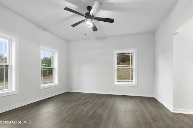 unfurnished room featuring ceiling fan and dark hardwood / wood-style flooring