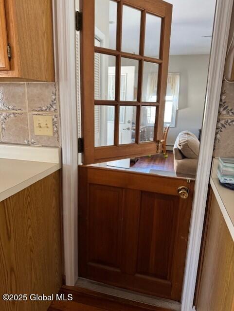 doorway with hardwood / wood-style floors