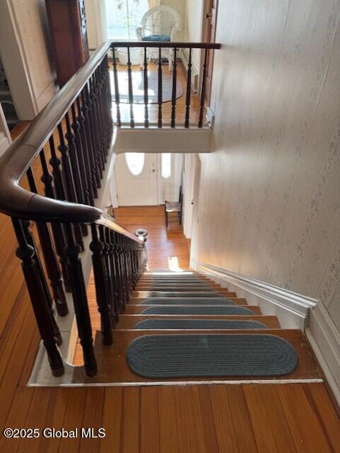 stairway with wood-type flooring