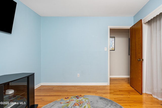 bedroom with light wood-type flooring