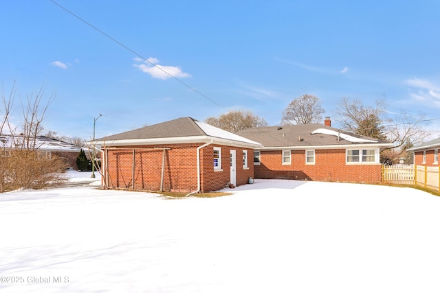 view of snow covered house