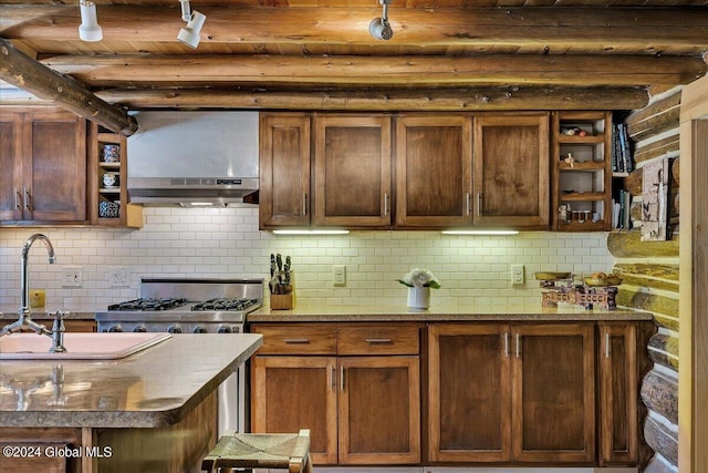 kitchen with wood ceiling, beamed ceiling, sink, and backsplash