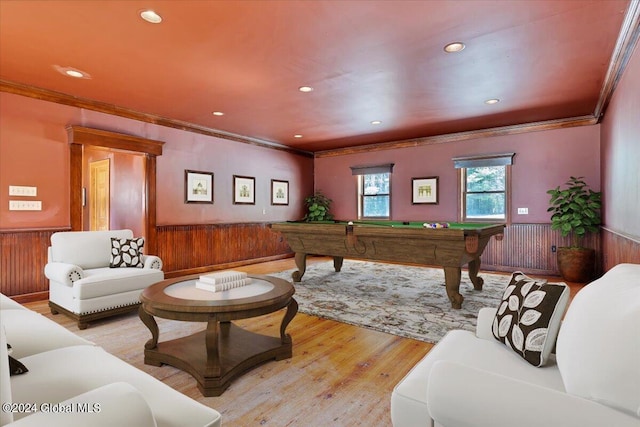 playroom featuring pool table, light hardwood / wood-style flooring, ornamental molding, and wooden walls