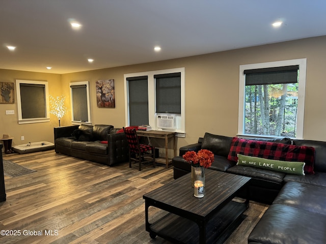 living room featuring cooling unit and hardwood / wood-style floors