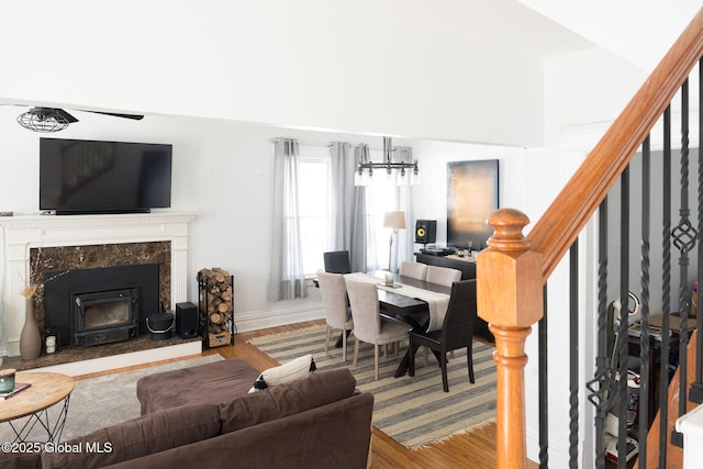 living room with stairs and wood finished floors