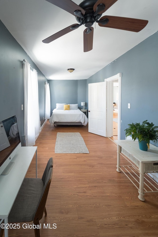 bedroom with ceiling fan and wood finished floors